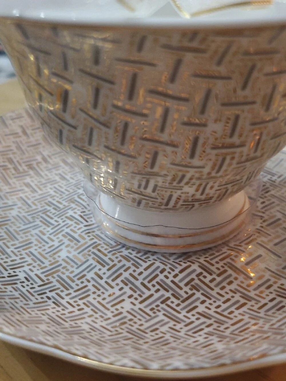 White and Gold Porcelain Teacup & Saucer - Decorative Pattern
